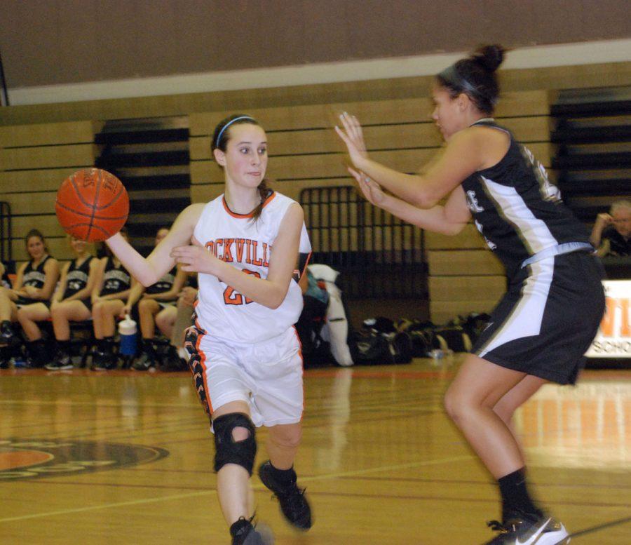 Freshman Kathleen McTighe searches for a pass in order to make a Rockville point.
