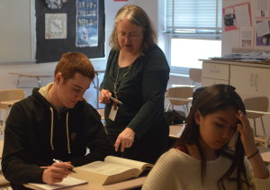 College test prep teacher Anne Ehlers assists senior Doug Trach with SAT practice questions. The course helps prepare students for all sections of the SAT: critical reading, math and writing. --Adam Bensimhon