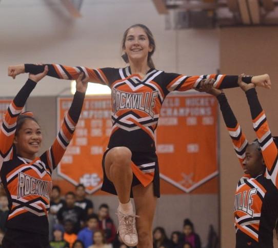 Varsity cheerleaders freshmen Gabrielle Kessel and Marie Noel Gomis lift sophomore Kelsey Hylton during their pep rally routine. They are eager to begin cheering at basketball games. --Adam Bensimhon