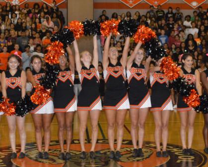 The poms perform their signature move, the worm, at the first pep rally of the year Sept. 5. --Claudia Mirembe