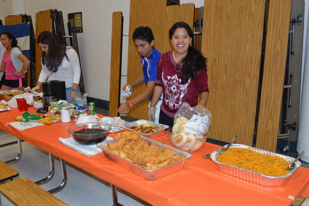 hispanic-club-volunteers-work-together-in-serving-hispanic-food-made-by