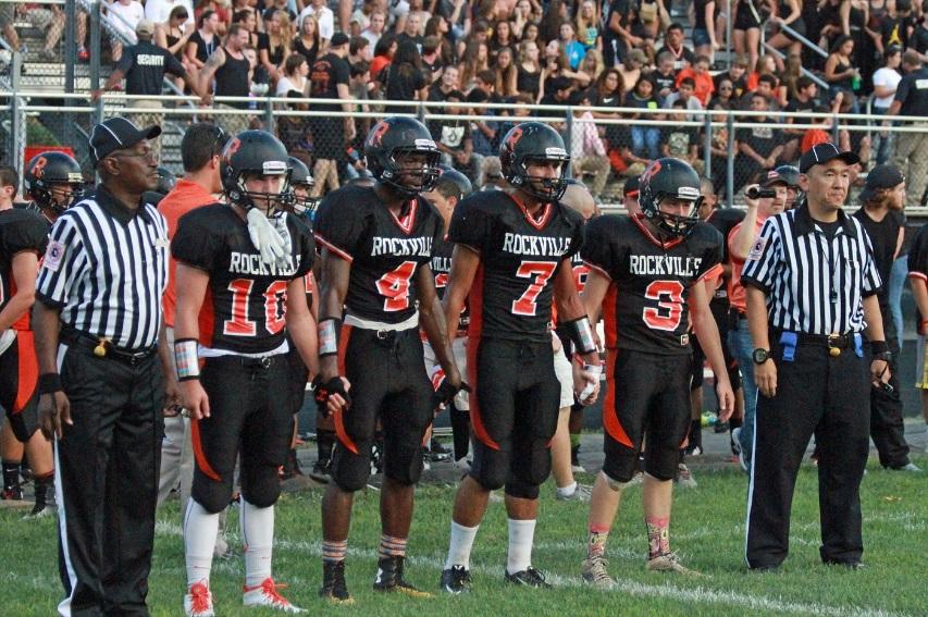 Senior captains Joey Cornwell, Louison Biama, Spencer Brigman and Chuck Reese line up for the coin toss against Richard Montgomery Sept. 5. --Lydia Barr