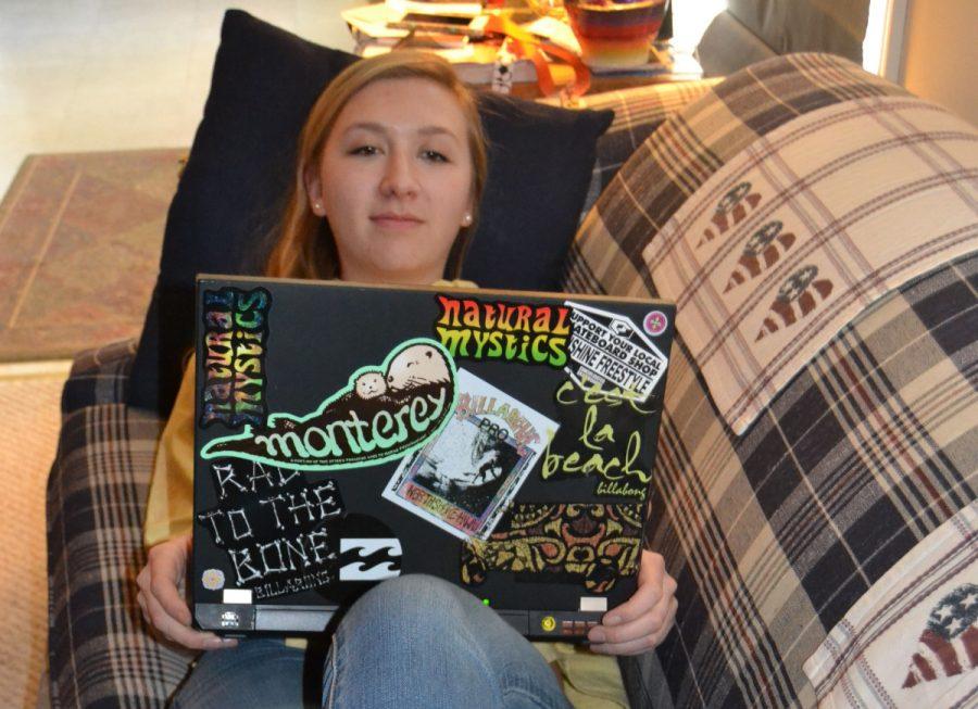 Senior Anna Walker opts to watch a movie on her laptop instead of paying the price at a movie theater.  --Thomas Sheil