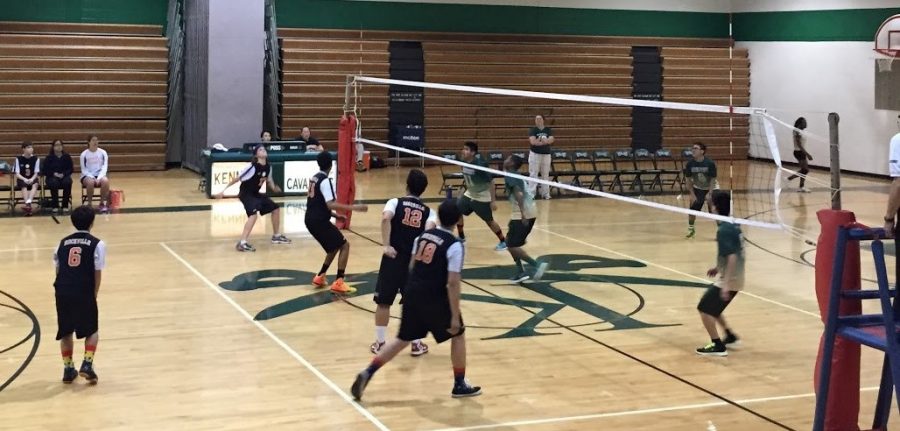 Sophomore outside hitter Doug Aubertin begins his approach as he is getting ready to hit sophomore setter Brandon Kim’s high set, while Kennedy players begin to jump to try and block Aubertin’s hit.