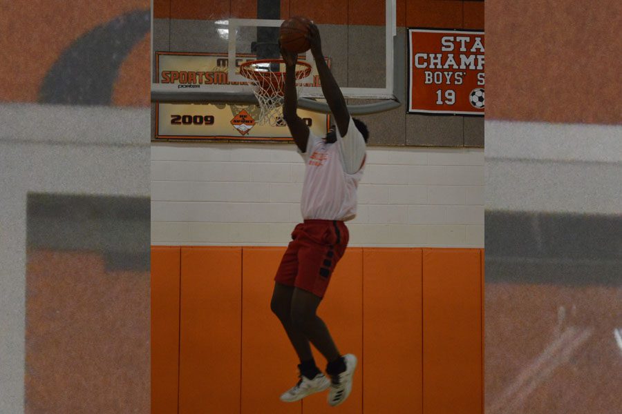 Sorunke trows down a dunk at practice at RHS. 