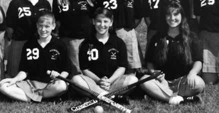 Lauren Mencarini Essig (center) poses for her 1994 varsity Field Hockey photo