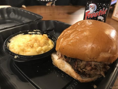 Pictured is Mission BBQ’s pulled pork sandwich with a side of macaroni and cheese. Their sandwich combination comes with a drink and two sides, and totals up to approximately $11. 