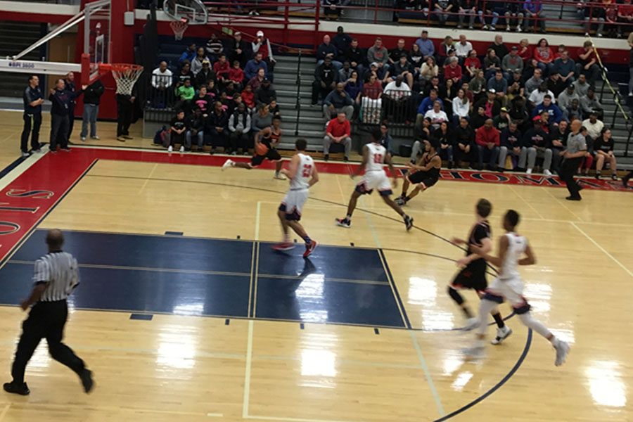 Senior guard Anthony McClean leads an offensive effort against the Thomas Johnson Patriots .