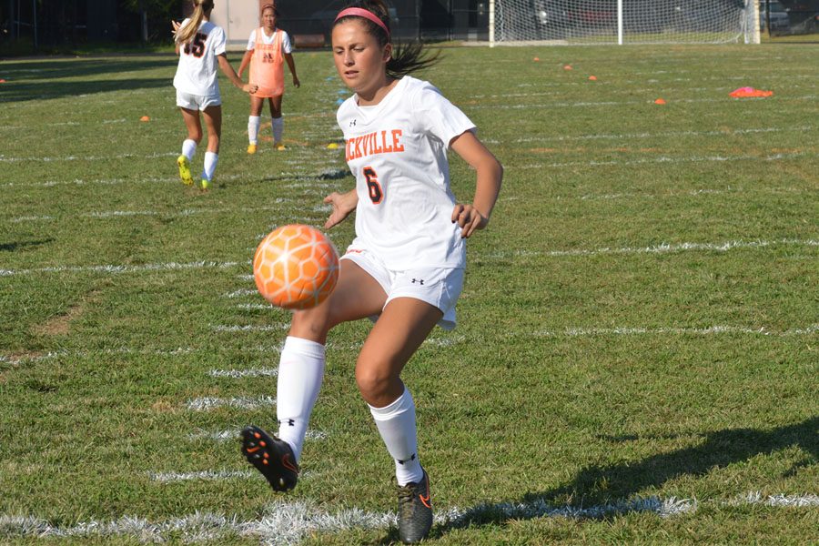 Varsity captian Senior Lauren Giron takes possession of the ball during a home game against Churchill HS in the 2016 season.