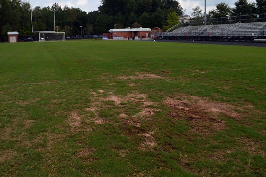 The new stadium field now has multiple dirt patches caused from recent flooding. The Bermuda grass was installed over the summer and was intended to be used for all fall sports games.
