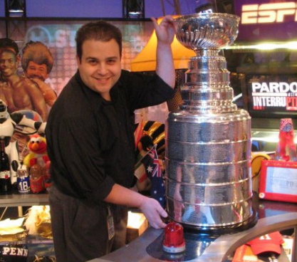 Media service technician Steve Mirman poses with the Stanley Cup while working for Comcast Sports Network, prior to working at RHS.  