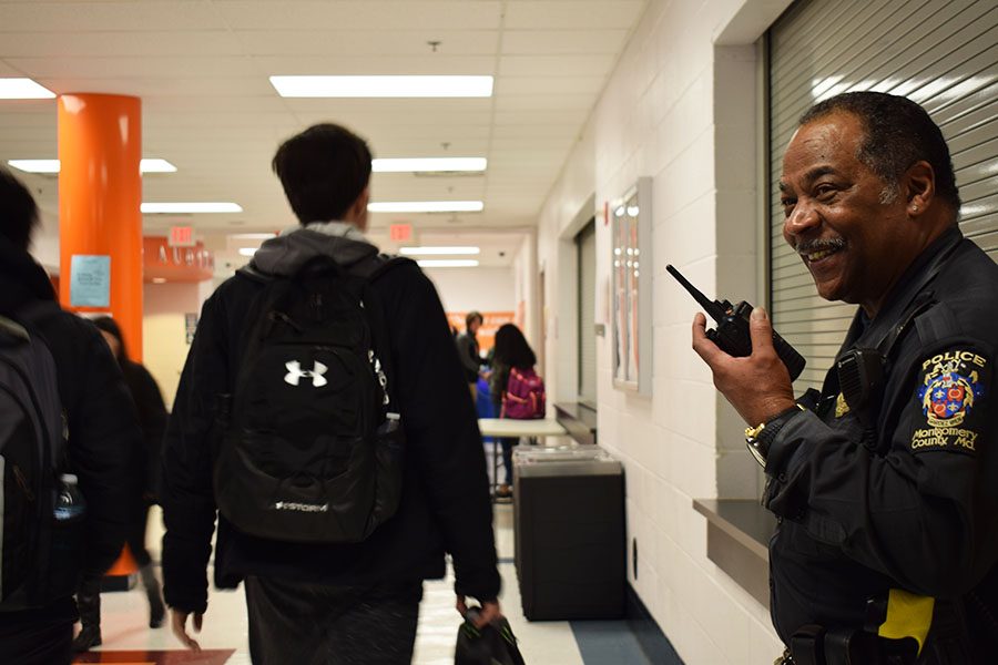 School Resource Officer, Arnold Aubrey watches as students pass by in the hallway during lunch. Aubrey has brought a new sense of safety and security to the school. 