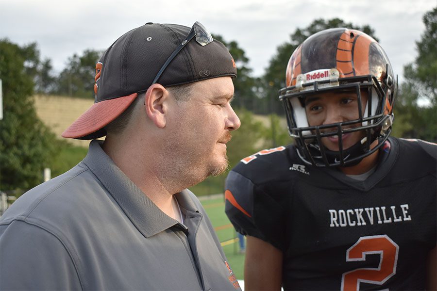 Head varsity football coach and child development teacher Jason Lomax (97) returned to RHS after three years coaching at Springbrook HS.