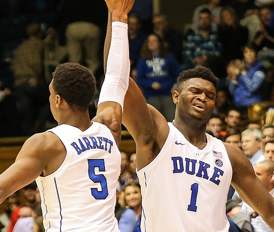 Duke forward Zion Williamson high fives guard R.J. Barrett.  Both players are projected to  be a top 3 pick in the 2019 NBA draft.