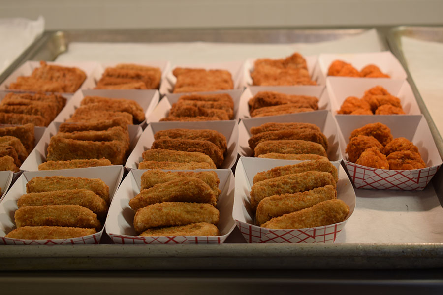 Mozzarella sticks laid out as one of a variety of lunch options for students.  Cafeteria managers are required to serve certain daily specials, though they have the flexibility to offer additional options.