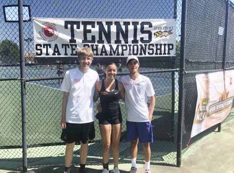 Pictured left to right: Senior Dennis Piliptchak, freshman Sania Suchinsky and junior Keeyan Mirzai celebrate May 25 after winning the tennis state championship.