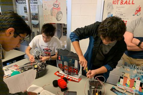 The Incredibots promote their robots at the annual RHS club fair. They are ranked fifth in the world after the Global Conference on Educational Robotics competition.