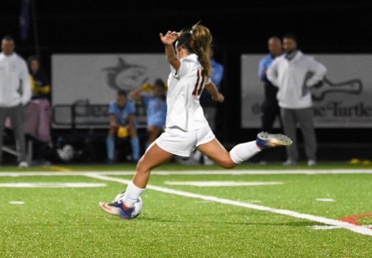 Varsity+soccer+player+and+junior+Morgan+Ward+clears+the+ball+from+her+teams+half+of+the+field+during+a+quarterfinals+game+at+Chesapeake+High+School.+Ward+continues+to+strengthen+her+skills+with+strenuous+practices+during+the+Covid-19++cancellation+of+RHS+in-person+sporting+events.