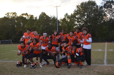 Senior football players pose for a picture after being introduced at their senior night ceremony. There were 13 seniors recognized in total, many of whom filled starting positions.

