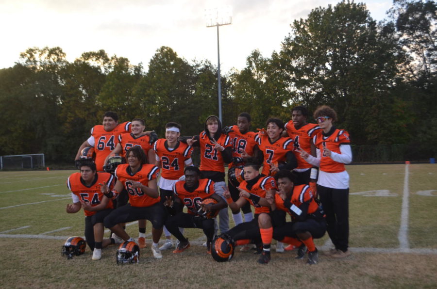 Senior football players pose for a picture after being introduced at their senior night ceremony. There were 13 seniors recognized in total, many of whom filled starting positions.

