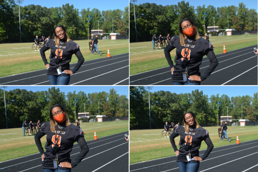 New principal Rhoshanda Pyles poses for a few pictures at the second pep rally of the year. Behind her, teachers set up for musical chairs as part of the homecoming competitions.