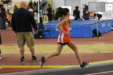 Senior Marisa Servis sets a school record while running the 1600 meter race in 2020. Servis also specializes in the  800 and 3200 meter races.
