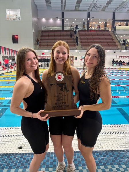 Photo of Girls Captains Holding State Finalist Trophy
